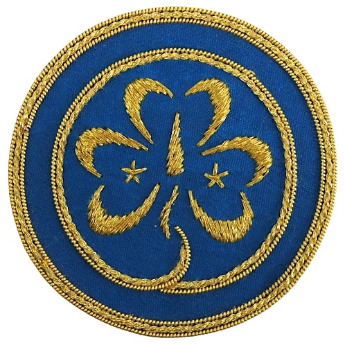 Emblemat Światowego Stowarzyszenia Przewodniczek i Skautek - WAGGGS