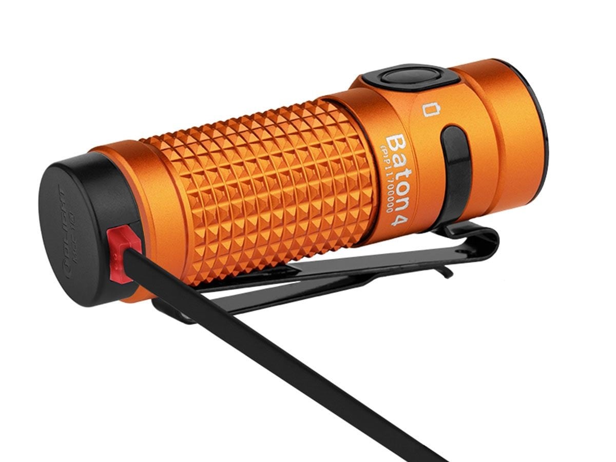 Latarka Olight Baton 4 Premium Edition Orange z bezprzewodowym etui ładującym - 1300 lumenów