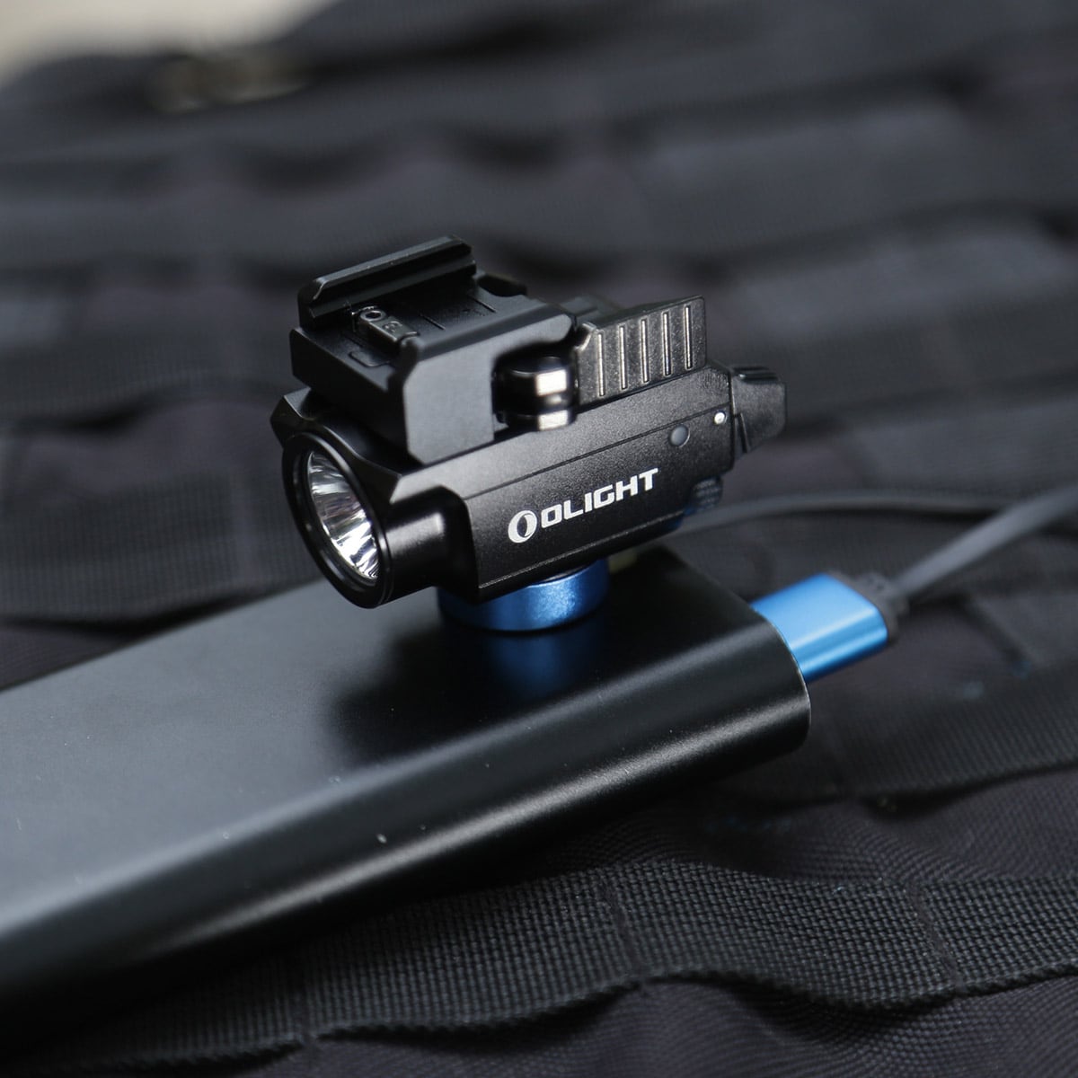 Latarka na broń z celownikiem laserowym Olight BALDR Mini - 600 lumenów, Green Laser